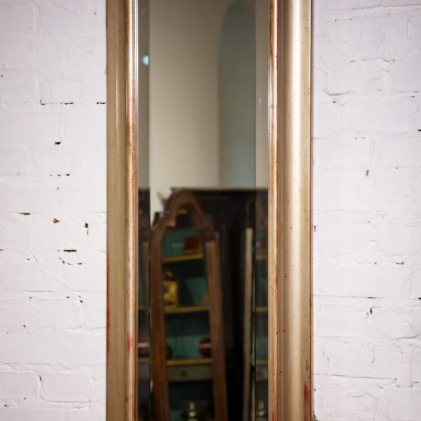 interior mirror with facet in an antique wooden frame